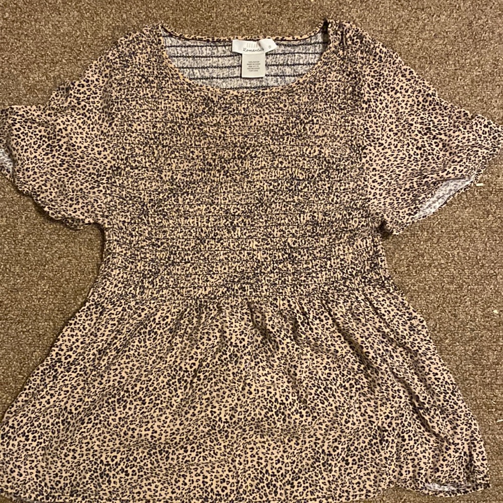 This is a cheetah print crop top it goes to about your stomach